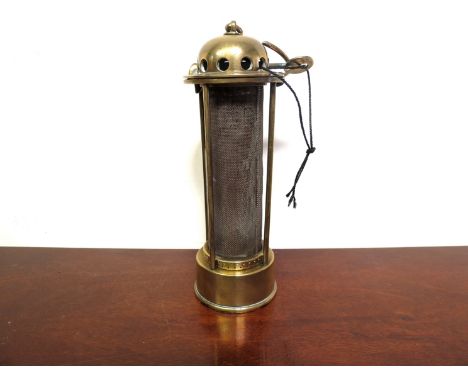 A Stephenson protector lamp, all brass with four rods protecting gauze, hinged dome top with brass key, stamped "J. Abbot", r