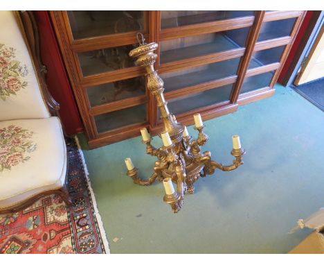 A 19th Century carved giltwood eight branch chandelier