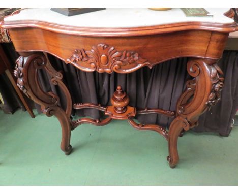 A French serpentine front Victorian walnut marble top side table the carved raised back over a single frieze drawer on C scro