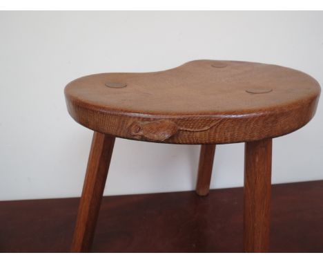 A Robert "Mouseman" Thompson three legged stool 