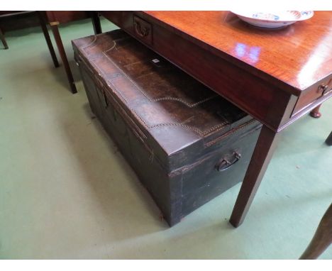 A 19th Century leather and studded trunk with drawer to interior