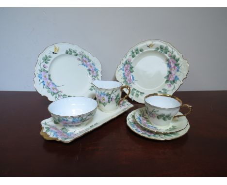 A circa 1950's handpainted tea service with floral decoration 
