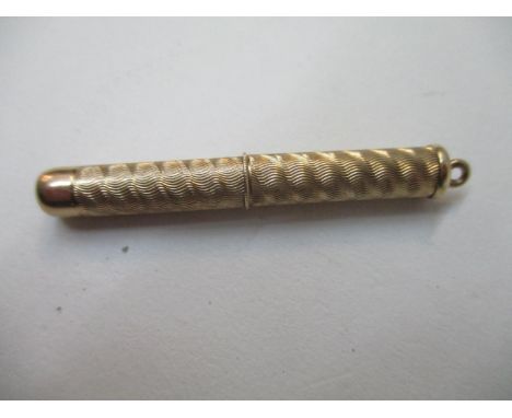 A 9ct gold retractable tooth pick with engine turned ornament, 6g total 