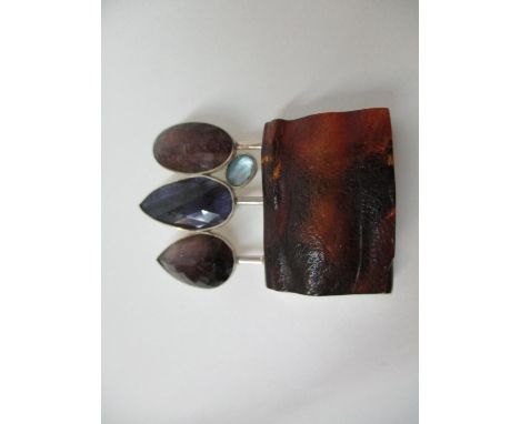 Ivone Brosch-Lobov An amber, tourmaline and amethyst coloured pendant set in a silver coloured frame 