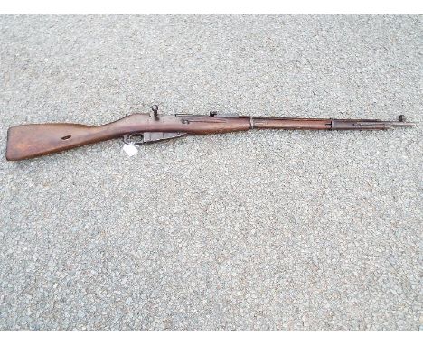 A Russian Mosin-Nagant rifle marked to the breech 1943 with Russian armory marks, with deactivation certificate, poor conditi