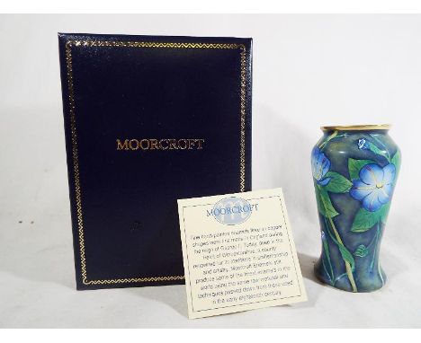 A Moorcroft fine handpainted enamel decorated in a floral design in original box 9.2 cm (h)

