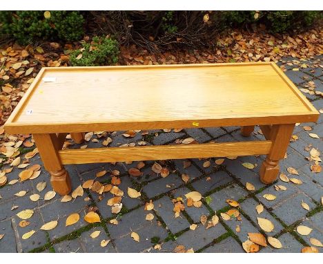 A good quality light wood rectangular coffee table by ONA, 43 cm x 120 cm x 51 cm