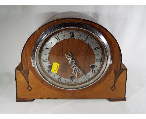 A mahogany cased mantle clock by Smiths of Enfield, Westminster chimes, Roman numerals on silver with pendulum and two keys 