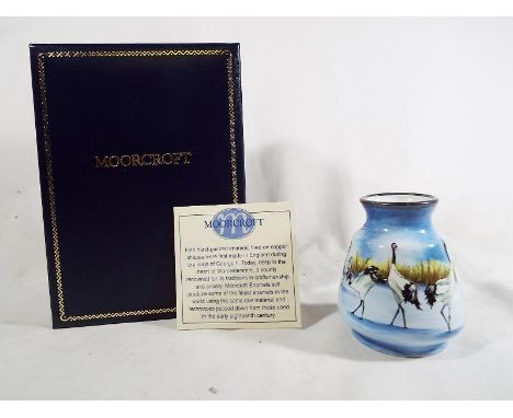 A Moorcroft fine handpainted enamel decorated with depictions of storks in original box 6.5 cm (h)