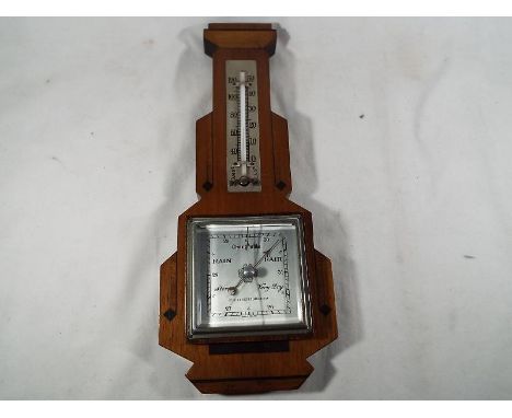 A mahogany and inlaid cased Art Deco style wall mounted aneroid barometer, the square silvered dial marked for Kelvin & Hughe