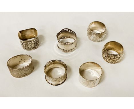 SEVEN HM SILVER NAPKIN RINGS 9OZS APPROX