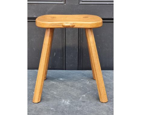 A Robert 'Mouseman' Thompson four legged cow stool, 37.5cm wide.
