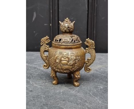 A Chinese bronze twin handled tripod censer and cover, Qianlong four character seal mark to base, 13.5cm high.