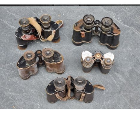 Five pairs of vintage binoculars,&nbsp;two with broad arrow stamps.