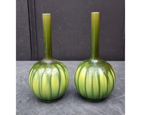 A pair of Burmantofts faience bottle vases,&nbsp;28.5cm high, (restoration to one).