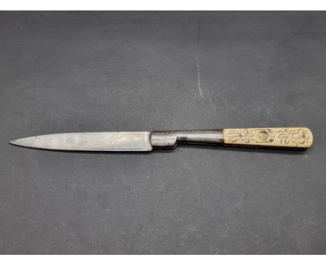 A Corsican vendetta folding knife, with 14.5cm blade inscribed 'Che&nbsp;la&nbsp;mia ferita sia Mortale', the bone scales dec