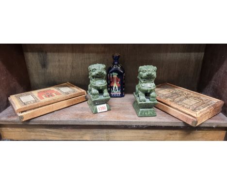 A mixed lot,&nbsp;comprising: an antique Dutch blue glass gin bottle, 16.5cm high; a pair of Chinese green soapstone lion dog