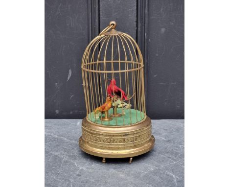 A lacquered brass singing bird-in-cage automaton,&nbsp;30cm high, boxed.