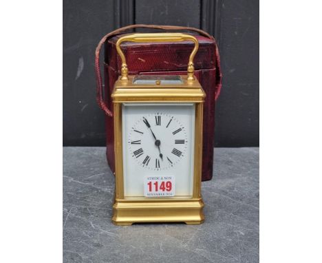 A French gilt brass carriage clock,&nbsp;striking on two gongs, with push button repeat, height including handle 19cm, with l