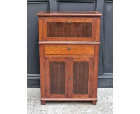 A 1930s Continental mahogany and walnut drinks cabinet,&nbsp;with hinged top, 69cm wide.