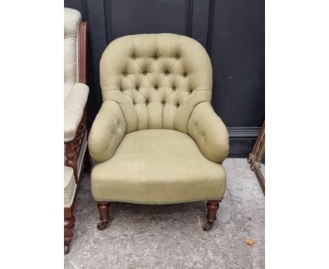 A Victorian walnut and button upholstered occasional armchair.&nbsp; 