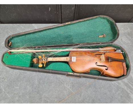 An antique Continental violin,&nbsp;labelled 'Antonius Stradivarius,... Anno 1735', with 14in two-piece back, with bow, in eb