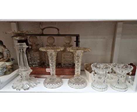 A Victorian clear glass lustre,&nbsp;28.5cm high; together with a smaller pair, 20.5cm high; another small pair of lustres; a