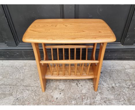 An Ercol 1079 table and magazine rack, 54.5cm wide.