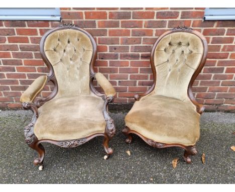 A pair of Victorian carved walnut and button upholstered occasional chairs. 