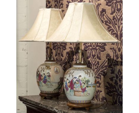 LAMPS, a pair, ceramic Chinoiserie decorated with figures, and pagoda shades, 69cm H. (old repairs) (2)