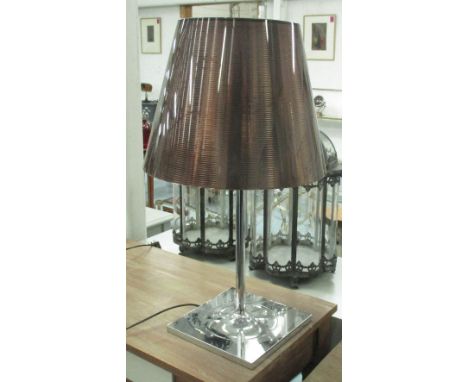 TABLE LAMP, on chromed metal base with a lucite shade, 71cm H.