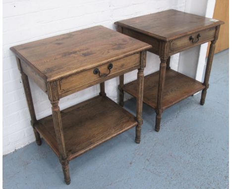 SIDE TABLES, a pair, by Oka, in oak with drawer and shelf below on turned fluted supports, 65cm x 45cm x 75cm H. (2)