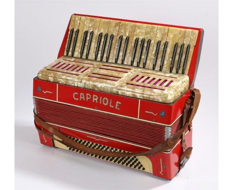 Capriole piano accordion, the red and black body with mother of pearl effect keys, housed in a fitted case