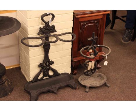 Two cast stick stands