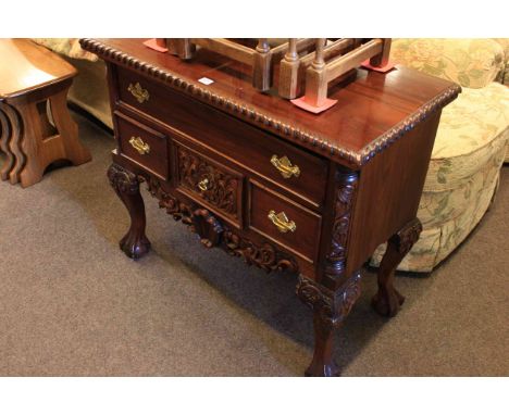Carved mahogany Chippendale style four drawer lowboy
