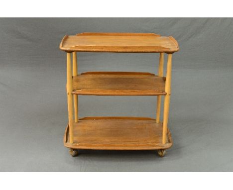 A BLONDE ERCOL THREE TIER TEA TROLLEY, with a gallery top, approximate size width 71cm x depth 45.5cm x height 74cm