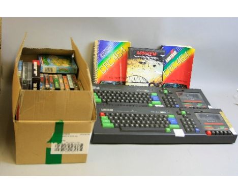 TWO AMSTRAD CPC464 VINTAGE PERSONAL COMPUTERS, with manuals and a box of over sixty games, no power supplies