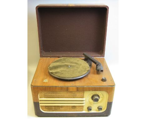 A FERGUSON RECORD PLAYER, with radio and valve amplifier, the turntable is a bakelite Garrard and the amplifier is badged Mar