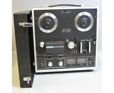 AN AKAI 1721L FOUR TRACK STEREOPHONIC REEL TO REEL RECORDER, with lid (untested)
