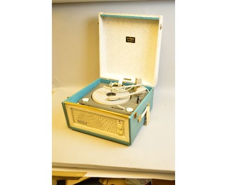 A DANSETTE BERMUDA RECORD PLAYER, in grey and teal green fitted with a Monarch turntable, inspection ticket and guarantee med