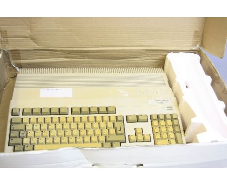 A COMMODORE AMIGA A500 PLUS VINTAGE PERSONAL COMPUTER, with power supply and mouse in original box