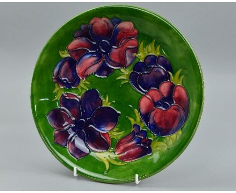 A MOORCROFT 'ANEMONE' PATTERN PLATE, in the green colourway impressed Moorcroft backstamp and initialled WM, diameter approxi