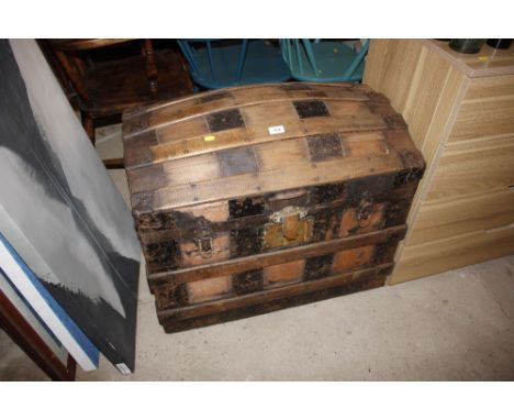 A wooden and metal bound dome topped trunk 