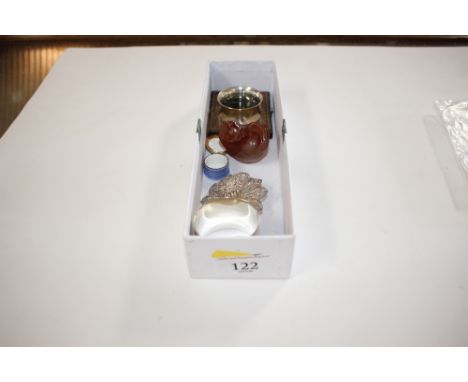 A box containing a silver napkin ring, a white metal filigree brooch, a Netsuke etc.