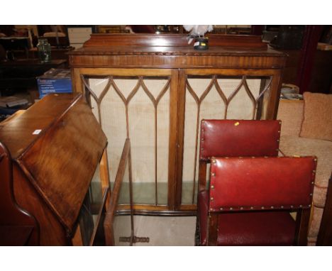 A mahogany bow front display cabinet 