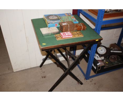 A folding card table with various games 
