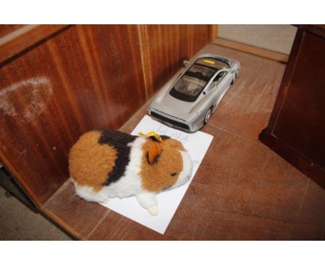 A Steiff guinea pig and a model Jaguar XJ220