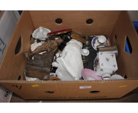 A box of containing Staffordshire spaniel ornaments; a china tea caddy and various sundries