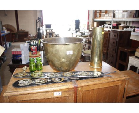 Two horse brasses; two small glass storage jars; a small knocker; a brass shell case etc.