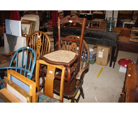 A stick and wheel back carver chair; together with one other 